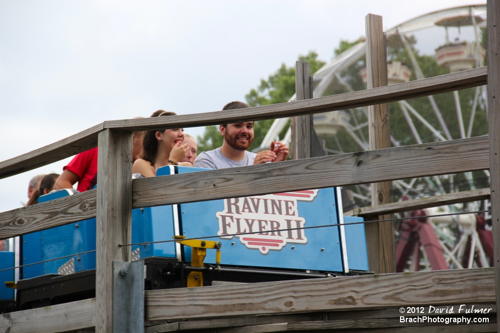 There are blue and red trains running on the coaster tracks!